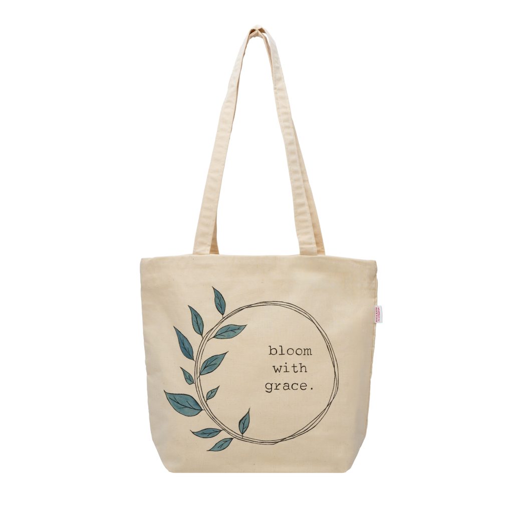 kala kath bag-"bloom with grace" written on it